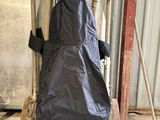 a black cover on the back of a cart in a warehouse