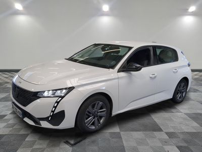 the white car is parked on a checkered floor in the garage