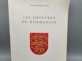 a book with a red and gold emblem on it