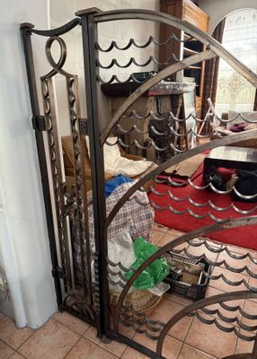 a metal gate that is open in a living room