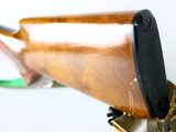 a rifle that is on top of a gun holder