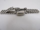 a close up of a watch bracelet on a white surface