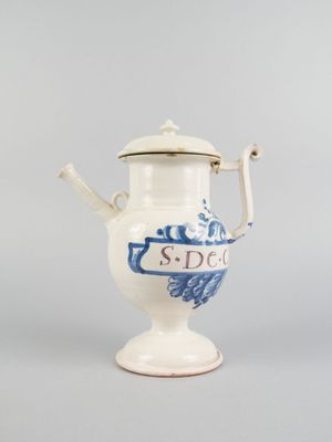 blue and white porcelain tea pot with a lid and handle