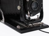 an image of an old fashioned camera on a white background