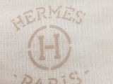 the logo of hermes ' s bar is shown on the back of a white shirt