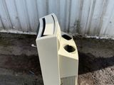 an old tv sitting on the ground next to a wall
