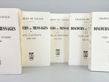 six books on a table with a gray background and a white background