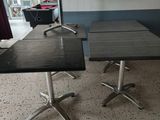two tables that are sitting in a room