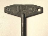a metal key with the word jeep on it