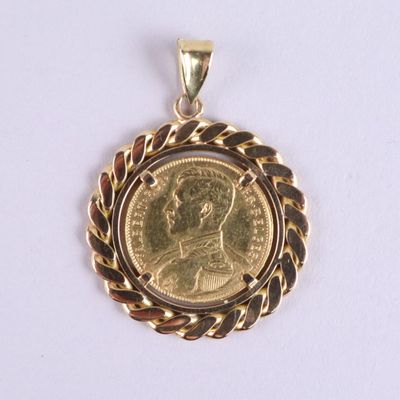 l'image d'une pièce d'or surmontée d'une couronne