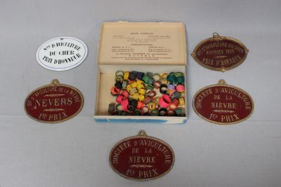 a box of assorted buttons in it on a table