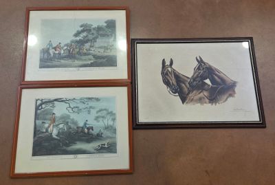 three framed prints of horses and riders on a wall in a room