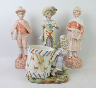 three figurines that are sitting next to each other