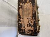 an old book sitting on top of a white sheet