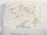an open book with a drawing of a group of people on it