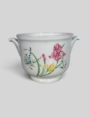 an image of a white bowl with flowers painted on it