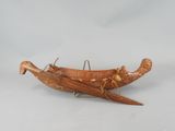 an image of a wooden boat that is sitting on a table