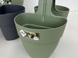 three different colored plastic bowls sitting next to each other