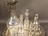 a silver tray that has a silver tray with glass items on it