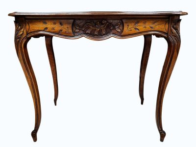 an old wooden table with a carved top on a white background