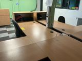 a desk with a computer and a monitor on it