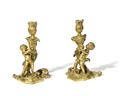 pair of antique brass figurines of a boy and a girl