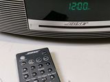 a clock that is on top of a radio