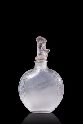 a clear glass bottle with a bird on the top of it