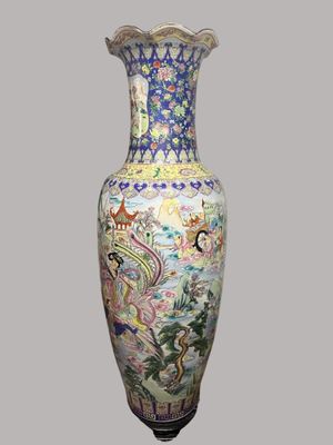 a vase that has a picture of a dragon on it