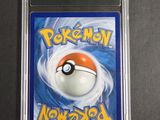 a close up of a pokemon card on a table