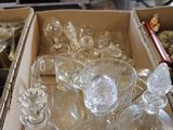 a box full of empty glassware on a counter