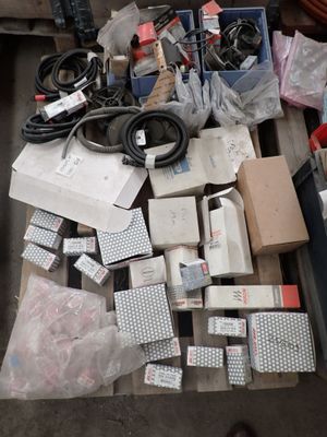 a pile of assorted electronic equipment on a table