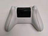 an image of a close up of a game controller on a table