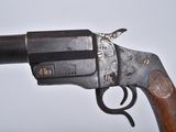 an old gun with a wooden handle on a white background