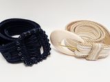 two belts that are sitting next to each other