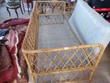 a bed that is made out of bamboo and has a metal frame