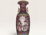 a vase with a picture of a woman and a cat on it