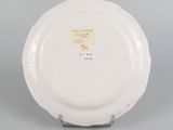 an image of a white plate with writing on it sitting on a table