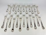 a lot of forks and spoons on the table