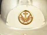 a white fireman ' s hat with a cross on it