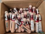 the contents of a box of makeup are packed together