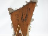 a small wooden chair with a metal frame on it