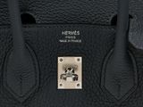 hermes ' s black leather handbag with gold hardware