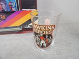 a shot glass with a picture of the band on it