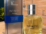 an image of a bottle of perfume sitting next to a box