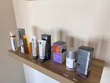many different types of skin care products displayed on a shelf