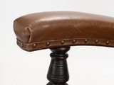 brown leather office chair with wooden legs and foot rest