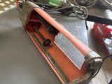a machine that is sitting on a table in a garage