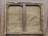an old picture of a window with a wooden frame on it