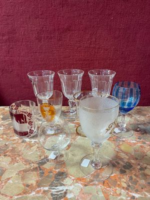 a lot of wine glasses sitting on a table